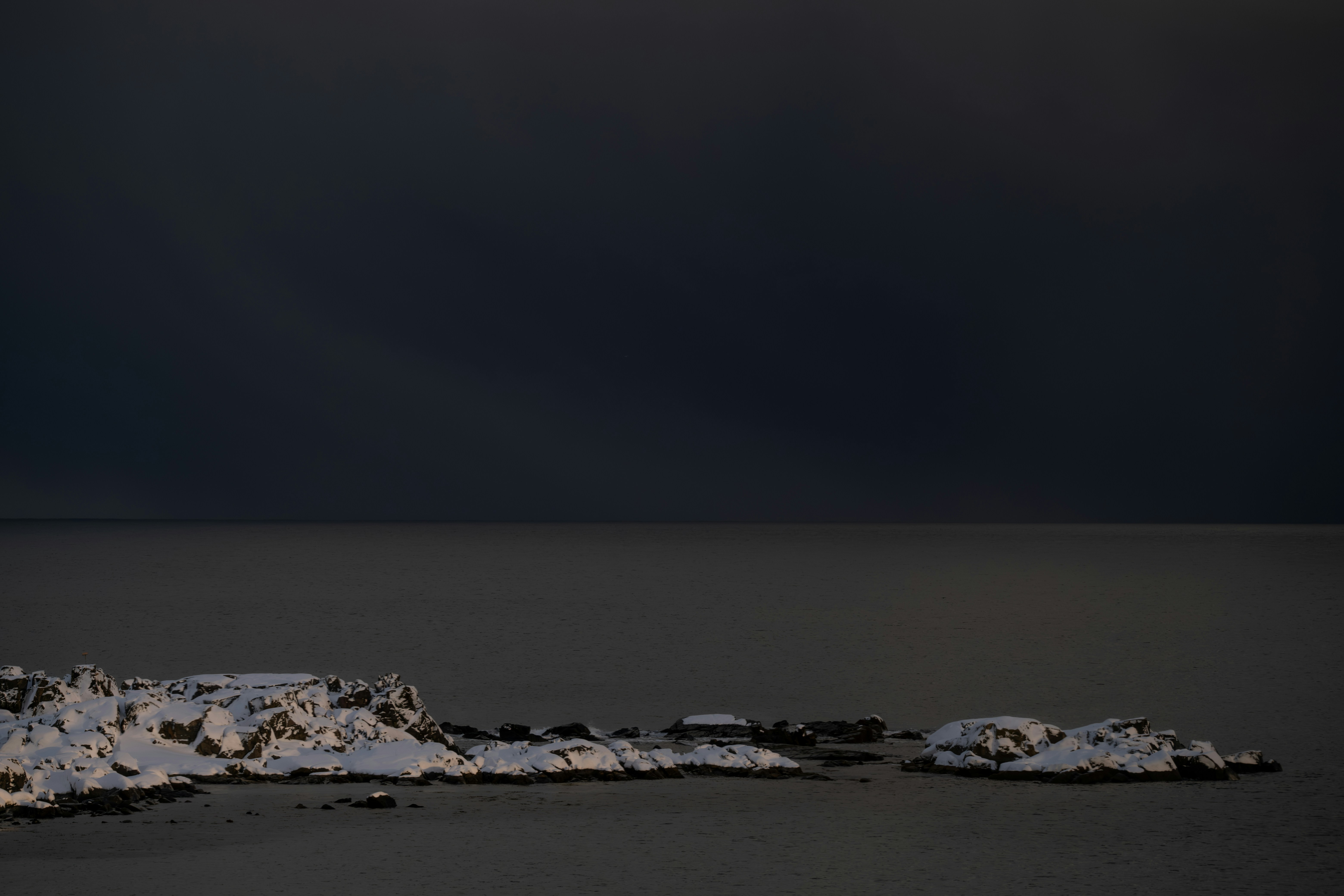 A black and white photo of snow on the ground
